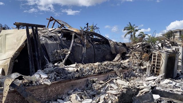 LAHAINA (U.S.), Aug. 15, 2023  -- The photo taken with a mobile phone on Aug. 14, 2023 shows a vehicle destroyed in a wildfire in Lahaina town, Maui Island, Hawaii, the United States. The death toll from the Maui wildfires reached 99, authorities said Mon