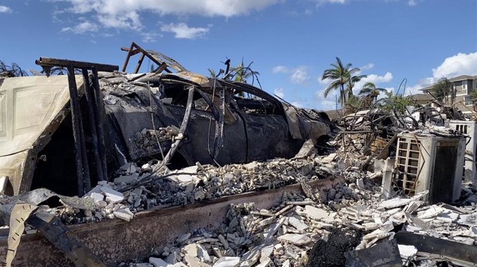 LAHAINA (U.S.), Aug. 15, 2023  -- The photo taken with a mobile phone on Aug. 14, 2023 shows a vehicle destroyed in a wildfire in Lahaina town, Maui Island, Hawaii, the United States. The death toll from the Maui wildfires reached 99, authorities said M