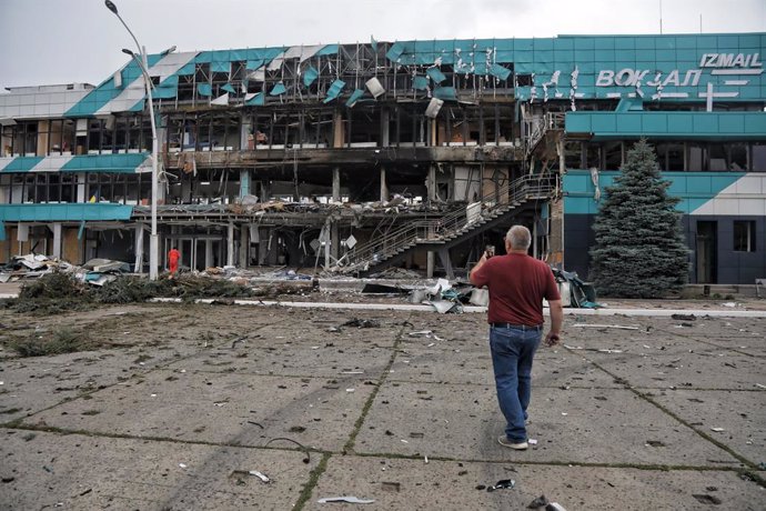 August 3, 2023, Izmail, Odesa Region, Ukraine: A man walks towards the building of the Marine Terminal damaged in the Russian drone attack on the port infrastructure of Izmail situated on the Danube River Wednesday night.