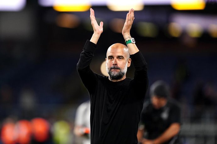 11 August 2023, United Kingdom, Burnley: Manchester City manager Pep Guardiola applauds the fans after the English Premier League soccer match between Burnley and Manchester City at Turf Moor. Photo: Mike Egerton/PA Wire/dpa
