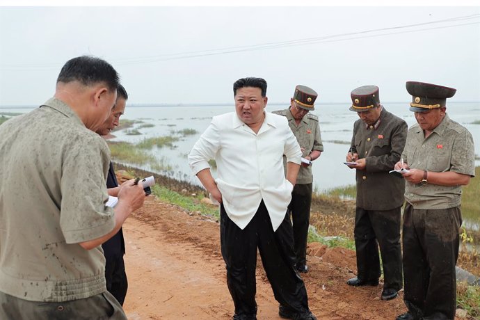 HANDOUT - 21 August 2023, North Korea, South Pyongan Province: A photo released by the North Korean state news agency (KCNA) on 22 August 2023 shows North Korean leader Kim Jong-un inspecting a reclaimed area in South Pyongan Province, inundated by water 