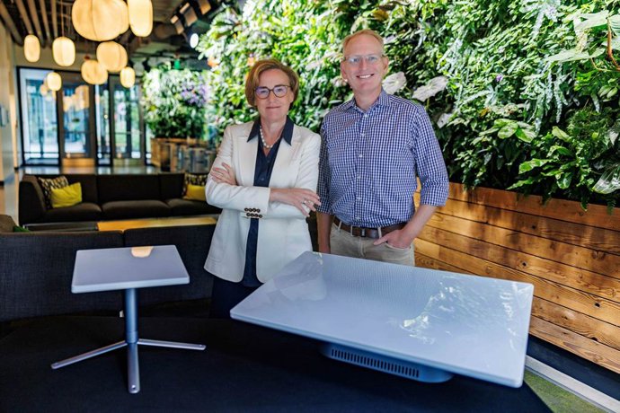 Margherita Della Valle, Vodafone Group Chief Executive, and Dave Limp, Amazon Senior Vice President of Devices and Services. The customer terminal antennas featured are used to send and receive data to and from Project Kuiper satellites.