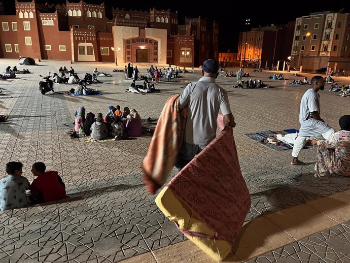 OUARZAZATE, Sept. 9, 2023  -- This photo taken with a mobile phone shows residents taking shelter at an open space after an earthquake in Ouarzazate, Morocco, Sept. 9, 2023. The death toll from a strong earthquake that struck Morocco Friday night has ri