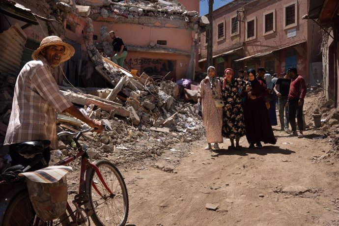 September 10, 2023, Azizmiz, Morocco: Two women carry another injured woman in front of a house destroyed by the earthquake in the city of Azizmiz. The earthquake in Morocco on Friday 8 September was the worst in the country's history, leaving more than 2
