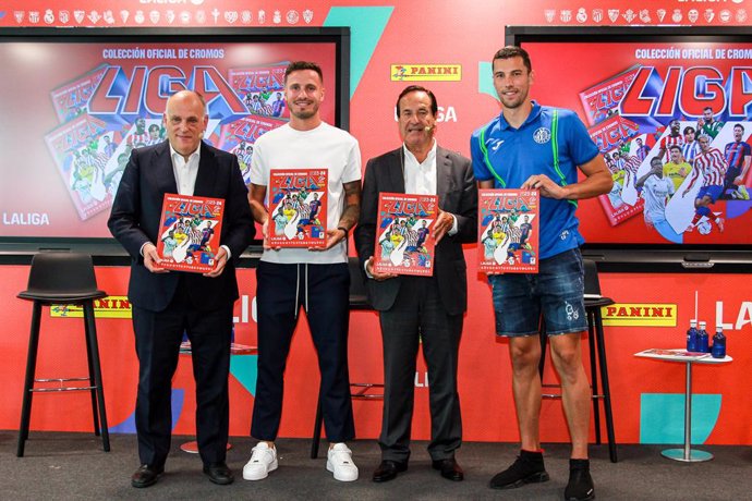Javier Tebas, President of La Liga, Lluis Torrent, President of Panini, Saul Niguez of Atletico de Madrid and David Soria, player of Getafe CF pose for photo during the presentation of the Panini La Liga EA Sports album at headquarters of La Liga on Sep