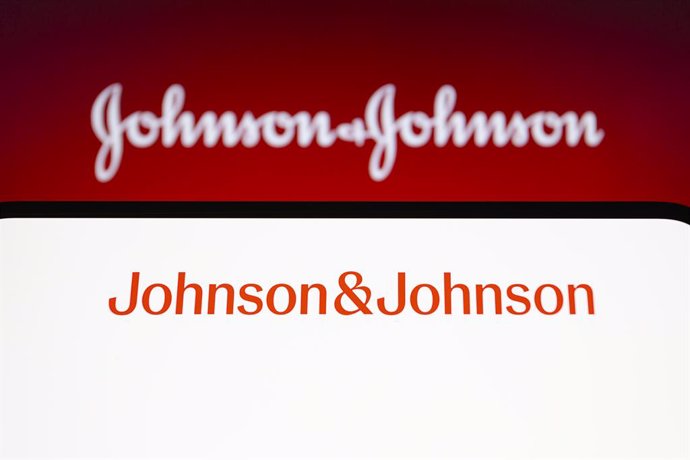 September 14, 2023, Asuncion, Paraguay: Johnson & Johnson new logo is displayed on a smartphone backdropped by its original script logo. Johnson & Johnson is updating its logo for the first time in more than 135 years, the company announced Thursday.