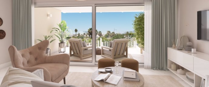 Salón abierto a la terraza en un apartamento en 'Mare', la nueva promoción de TWE en Marbella.