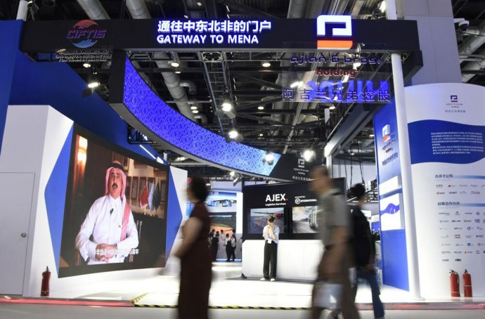 Visitors walk past the booth of Ajlan & Bros. Holding during the 2023 China International Fair for Trade in Services (CIFTIS) at China National Convention Center in Beijing, capital of China, Sept. 4, 2023.