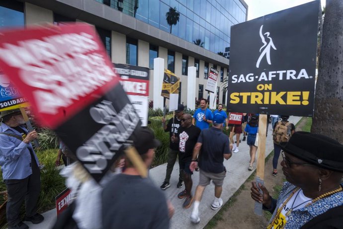 September 21, 2023, Los Angeles, California, United States: Striking writers and actors walk with placards outside Sunset Bronson studios during the demonstration. Negotiators for the striking Writers Guild of America met for a second straight day with 
