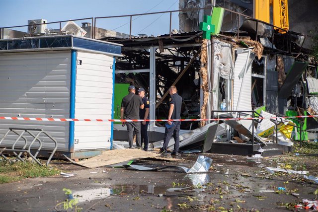 September 21, 2023, Cherkasy, Ukraine: CHERKASY, UKRAINE - SEPTEMBER 21, 2023 - State Emergency Service workers stay by crashed pavilions at a local market during a response effort to the recent Russian missile attack in Cherkasy, central Ukraine. As repo