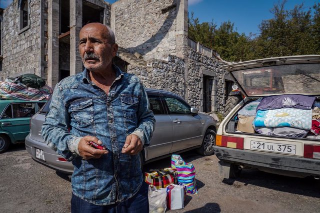 September 30, 2023, Goris, Armenia: Boris, 64, a resident of Stepanakert, Karabakh  is seen reacting next to his vehicle packed with his families belongings. He said there was no way for them to stay in Karabakh due to the shortage of food and under const