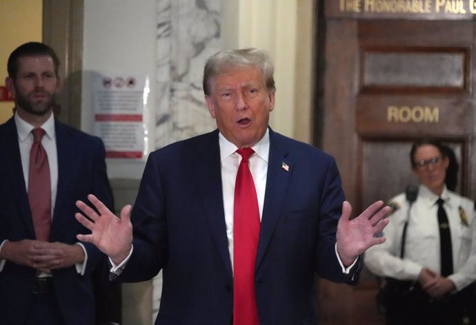 October 4, 2023, New York, NY, USA: Trump Fraud Trial Day 3-.DONALD TRUMP holds impromptu press conference in the New York County Courthouse, with ERIC TRUMPM in the background..60 Centre Street, NYC.October 4, 2023.Photo by