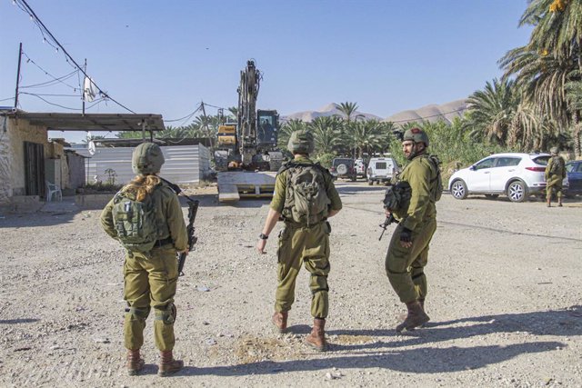 September 18, 2023, Jordan Valley, West Bank, Palestine: Israeli soldiers on guard against the Palestinians during the demolition of Palestinian homes in the northern Jordan Valley in the occupied West Bank. Israeli army bulldozer demolished Palestinian h