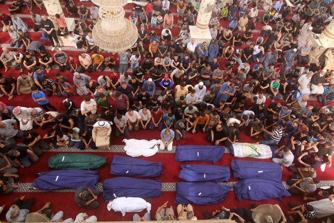 October 8, 2023, Rafah, Gaza Strip, Palestinian Territory: People gather at a mosque to pray over the bodies of the Abu Quta family and their neighbours, killed in Israeli strikes on the Palestinian city of Rafah in the southern Gaza Strip, during their