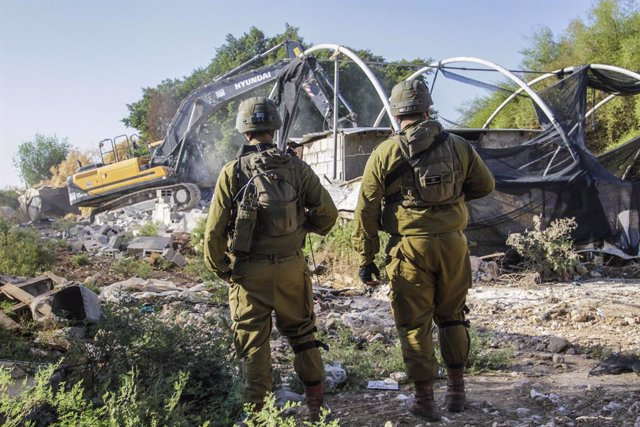 September 18, 2023, Jordan Valley, West Bank, Palestine: Bulldozers seen as Israeli soldiers on guard against the Palestinians during the demolition of Palestinian homes in the northern Jordan Valley in the occupied West Bank. Israeli army bulldozer demol