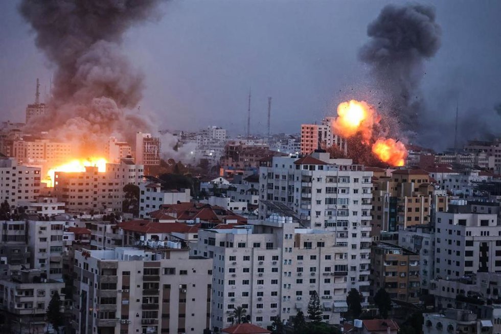 October 9, 2023, Gaza, Palestine: Flames and smoke billow during Israeli strikes in Gaza. Israel imposed a total siege on the Gaza Strip on October 9 and cut off the water supply as it kept bombing targets in the crowded Palestinian enclave in response 