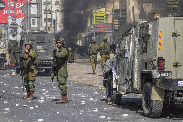 October 6, 2023, Nablus, West bank, Palestine: Israeli soldiers seen on guard during the demonstration after Jewish settlers attacked them and killed the defenseless young man, Labib Muhammad, in the town of Howwarah.