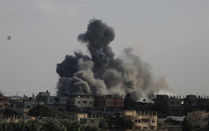 GAZA, Oct. 10, 2023  -- Birds fly as smoke billows following an Israeli airstrike in the southern Gaza Strip city of Rafah, on Oct. 10, 2023. The conflict has taken a heavy toll on both sides. The Palestinian Health Ministry reported on Tuesday that the