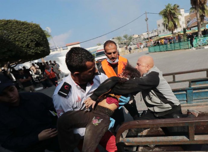 October 14, 2023, Deir al-Balah, Gaza Strip, Palestinian Territory: Palestinian paramedics treat wounded Palestinians, including children, at Al-Aqsa Hospital in the city of Deir al-Balah in the central Gaza Strip, on October 14, 2023. Thousands of Pale