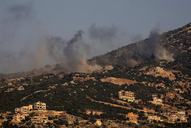 BEIRUT, Oct. 15, 2023  -- This photo taken in the Lebanese town of Al-Marion shows smoke billowing following an Israeli missile bombardment on the town of Shebaa in southeast Lebanon, Oct. 14, 2023. A fighter with Hezbollah, a Lebanese military group, was