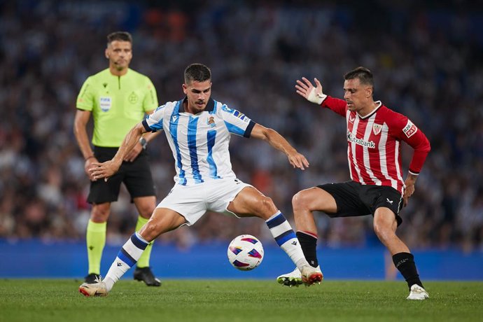 Andre Silva of Real Sociedad competes for the ball with Dani Garcia of Athletic Club during the LaLiga EA Sports match between Real Sociedad and Athletic Club at Reale Arena on September 30, 2023, in San Sebastian, Spain.