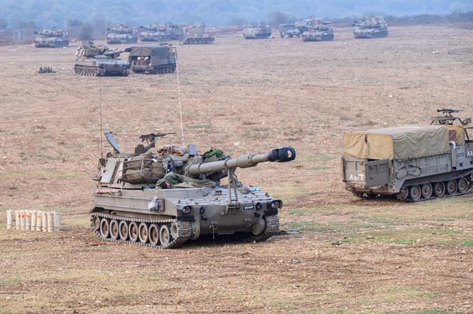 JERUSALEM, Oct. 8, 2023  -- This photo taken on Oct. 8, 2023 shows Israeli military vehicles in northern Israel near the border with Lebanon.   Dozens of rockets and heavy artillery shells were fired toward Israeli positions on the Shebaa Farms, a dispu