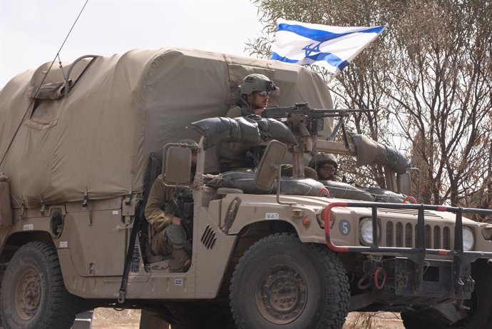 ISRAEL-GAZA BORDER, Oct. 16, 2023  -- An Israeli military vehicle runs near the Israel-Gaza border in southern Israel, on Oct. 16, 2023. Israel on Sunday continued its preparations for a massive ground operation in Gaza, mobilizing forces near the Gaza 