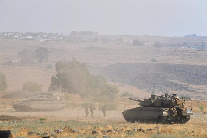 JERUSALEM, Oct. 8, 2023  -- This photo taken on Oct. 8, 2023 shows Israeli tanks in northern Israel near the border with Lebanon.   Dozens of rockets and heavy artillery shells were fired toward Israeli positions on the Shebaa Farms, a disputed strip of l