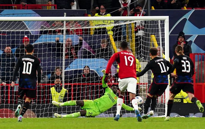 24 October 2023, United Kingdom, Manchester: Manchester United goalkeeper Andre Onana saves a penalty from FC Copenhagen's Jordan Larsson during the UEFA Champions League group A soccer match between Manchester United and FC Copenhagen at Old Trafford. 