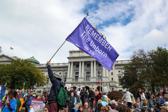 October 16, 2023, Harrisburg, Pennsylvania, United States: A protester holds a flag during the third annual Pennsylvania March for Life. Thousands of people came together at the Pennsylvania Capitol to express their anti-abortion views during the Pennsy