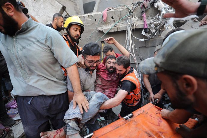 October 24, 2023, Nusairat, Gaza Strip, Palestinian Territory: Palestinians rescue a survivor of Israeli bombardment of the Gaza Strip in Nusseirat refugee camp, Tuesday, Oct. 24, 2023