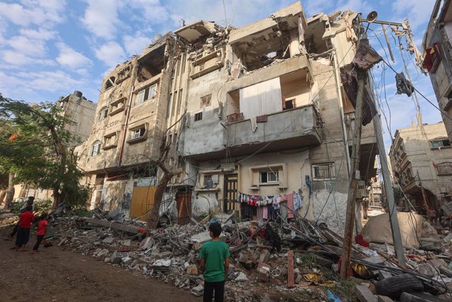October 27, 2023: Palestinian children stand infront of a  destroyed house in Khan Yunis, in the southern Gaza Strip on October 27, 2023, amid the ongoing battles between Israel and the Palestinian group Hamas. Thousands of civilians, both Palestinians an