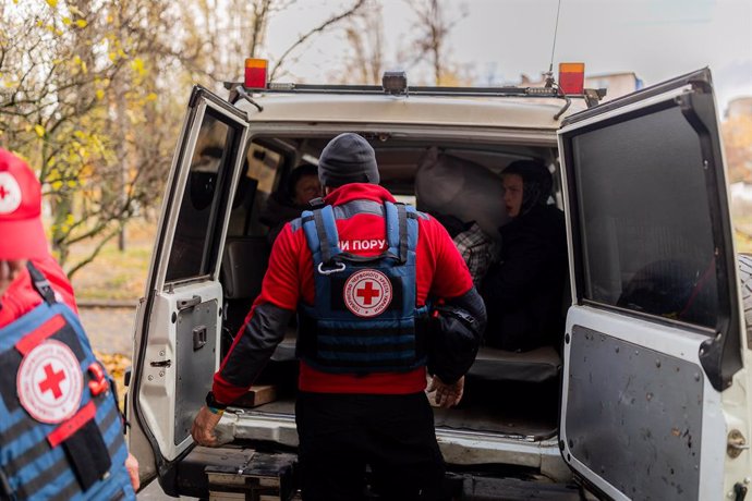 October 28, 2023, Kupiansk, Charkiv, Ukraine: Two Ukrainian Red Cross volunteers prepare their car before leaving Kivsharivka, near Kupiansk frontline.