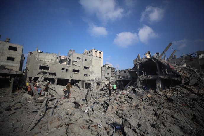 November 2, 2023, Bureij, Gaza Strip, Palestinian Territory: People sift through the smouldering rubble of buildings destroyed in an Israeli strike on the Bureij refugee camp in the central Gaza Strip on November 2, 2023, as battles between Israel and the