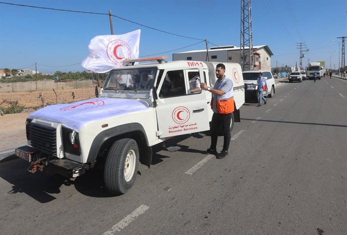 October 21, 2023, Gaza, Palestine: An employee from the Palestinian Red Crescent Society prepares to enter the Rafah crossing to receive the aid convoy from Egyptian side, at Rafah border. United Nations (UN) agency is expected to deliver humanitarian a