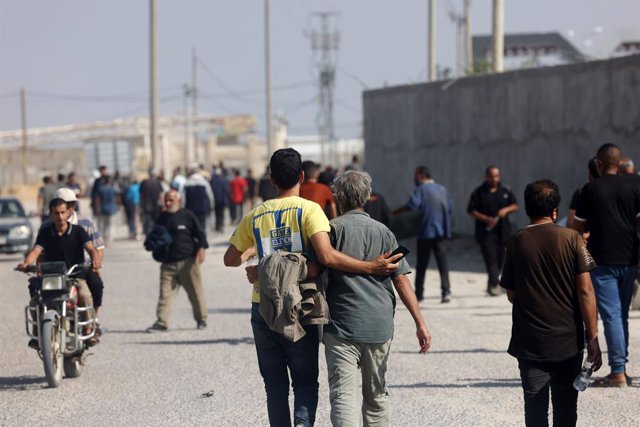 November 3, 2023, Rafah, West Bank, Palestinian Territory: Palestinian workers, who were stranded in Israel since the October 7 attacks, walk near the Rafah border crossing with Egypt as they make their way to cross back into the Gaza Strip at the Kerem S