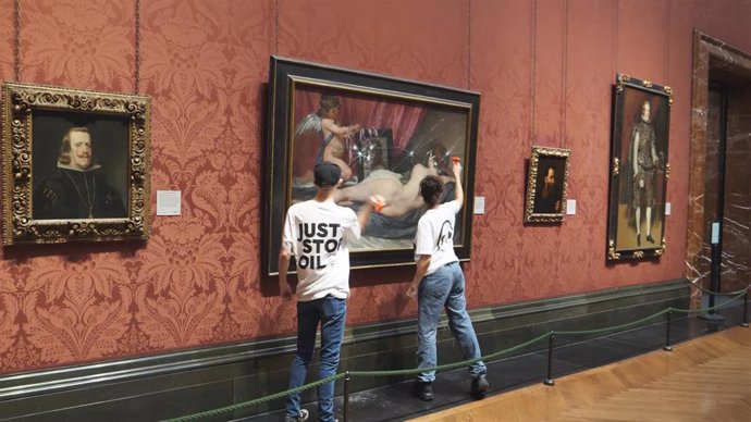 06 November 2023, United Kingdom, London: Two Just Stop Oil protesters smash a painting at the National Portrait Gallery in London. Photo: Just Stop Oil/PA Media/dpa