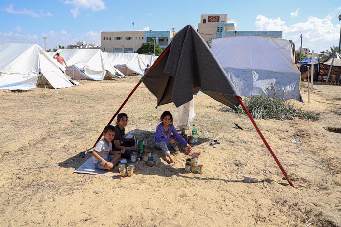 GAZA, Oct. 19, 2023  -- Displaced Palestinian children are seen in a temporary shelter at a training college affiliated with the United Nations Relief and Works Agency for Palestine Refugees in the southern Gaza Strip city of Khan Younis, Oct. 19, 2023. T