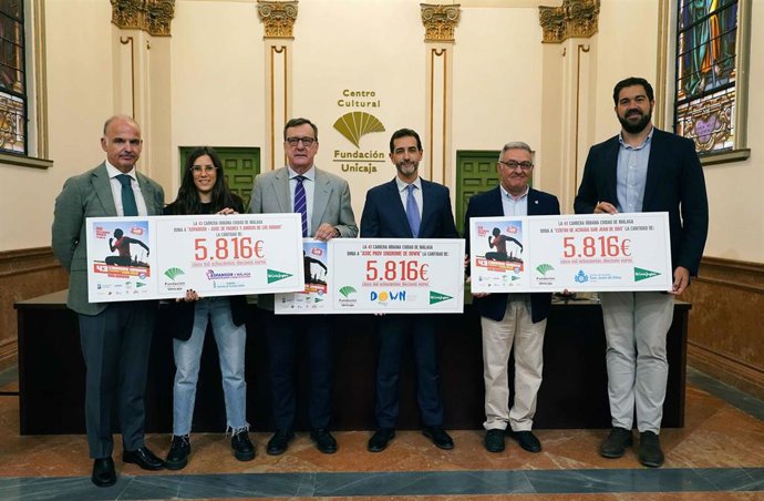 El Centro de Acogida San Juan de Dios, Down Málaga y Aspansor reciben la recaudación de la 43 Carrera Urbana Ciudad de Málaga