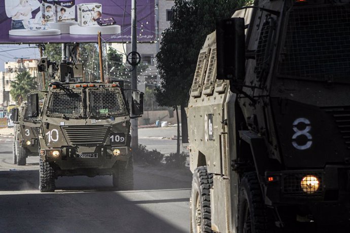 November 9, 2023, Jenin, Palestine: Israeli military reinforcements arrive at Jenin refugee camp during a bloody raid that continues to date. Israeli forces raided Jenin refugee camp and entered with their forces inside, which led to an exchange of fire b