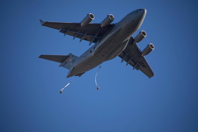 October 31, 2023, Pohakuloa Training Area, HI, United States: U.S. Army paratroopers, with the 11th Airborne Division jump from a C-17 transport aircraft during the multinational Joint Pacific Multinational Readiness Center 24-01 at the Pohakuloa Training