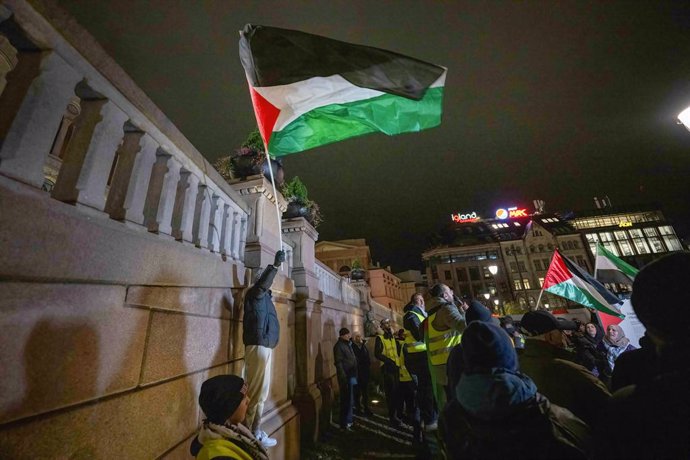 November 3, 2023, Oslo, Norway: A protester waves a Palestinian flag while shouting anti-war slogans during a rally outside the Norwegian parliament. The Israeli army launched an intense wave of attacks on Gaza on Saturday (7 October) after Hamas, the Isl