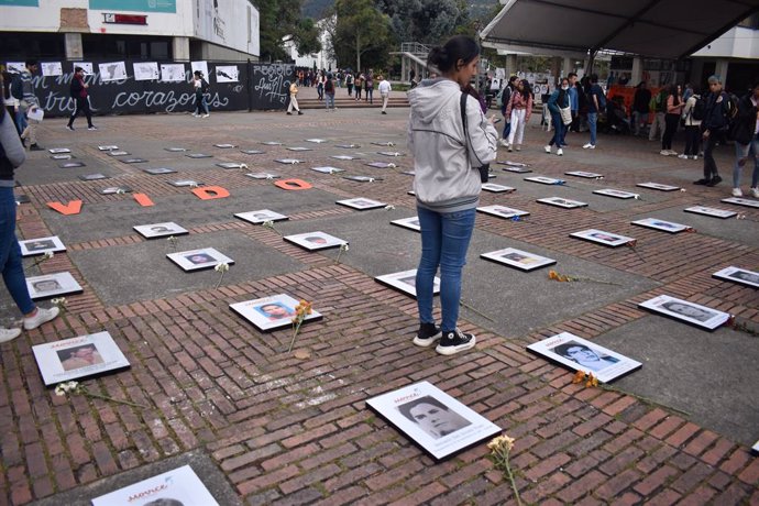 Archivo - August 30, 2022, Bogota, Cundinamarca, Colombia: Photos of victims of enforced disapearances are seen with the word phrase ''Never Forgotten'' during the framework of the International Day of the Victims of Enforced Disappearances in Bogota, Col