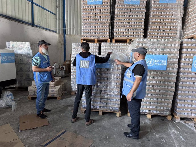November 4, 2023, Dair El-Balah, Gaza Strip, Palestinian Territory: Workers of the United Nations Relief and Works Agency for Palestine Refugees (UNRWA) pack the medical aid and prepare it for distribution to Shelter centers at a warehouse in Deir Al-Ba