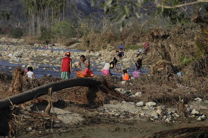 November 2, 2023, Coyuca de Bénitez, Guerrero, Mexico: People from the community of Aguas Blancas washing in the river after their homes were destroyed by Hurricane Otis, a category 5 hurricane.