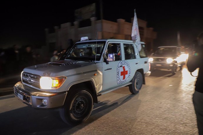 GAZA, Nov. 24, 2023  -- Vehicles belonging to the International Committee of the Red Cross transport released hostages toward the Rafah crossing in the southern Gaza Strip, on Nov. 24, 2023. Israel's Shin Bet internal security agency has received the firs