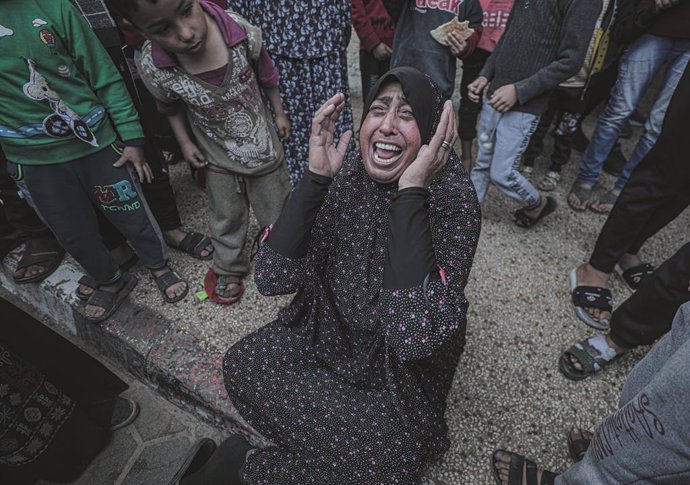 December 2, 2023: A distraught Palestinian woman following Israeli airstrikes in Deir Al Balah, in the central Gaza Strip. Israeli forces have resumed the fierce bombardment of the Gaza Strip after a 6-days humanitarian truce and pause in the fighting bet