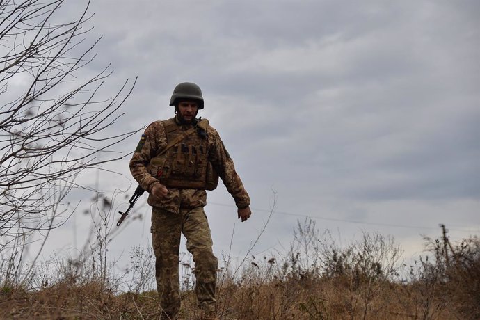 November 26, 2023, Kyiv, Donetsk, Ukraine: A Ukrainian soldier returns to his position following a completed fire mission. Soldiers with the 56th brigade continue to work in the Bakhmut region as winter approaches.