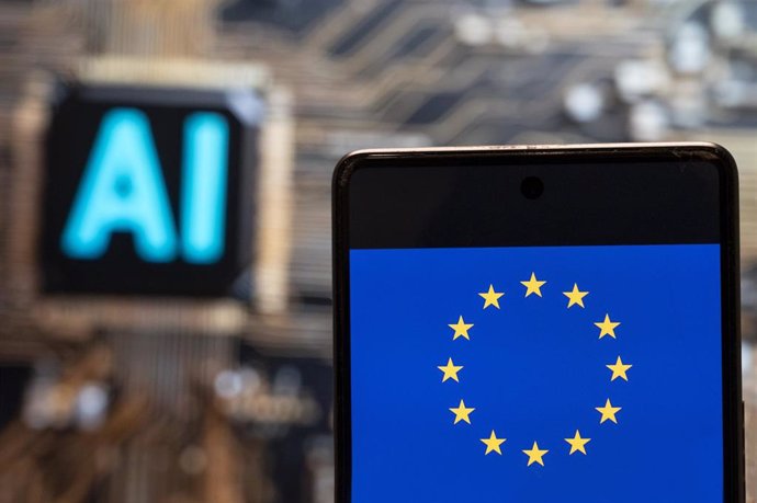 Archivo - November 3, 2023, China: In this photo illustration, the European Union (EU) logo and flag seen displayed on a smartphone with an Artificial intelligence (AI) chip and symbol in the background.