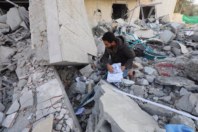 December 8, 2023, Dair El-Balah, Gaza Strip, Palestinian Territory: Palestinians inspect the wreckage following an Israeli air strike on the Jaffa Mosque and Hospital in Dair El-Balah, on December 8, 2023. amid continuing battles between Israel and the Pa